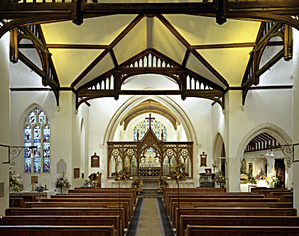 Interior looking down the nave towards the screen and altar.