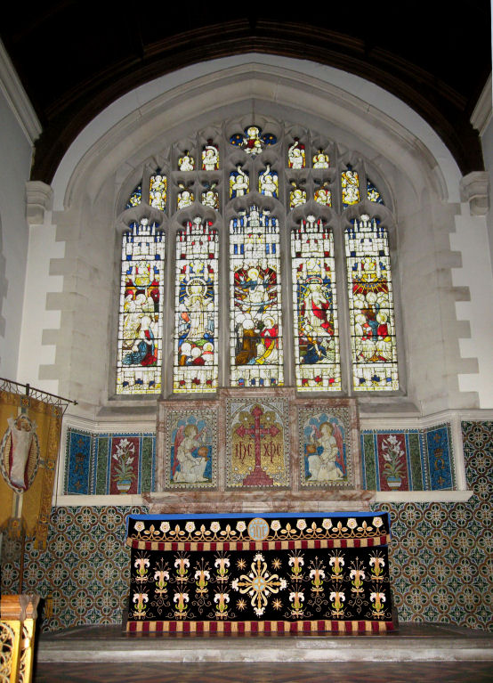 The altar with its beautiful reredos and windows.
